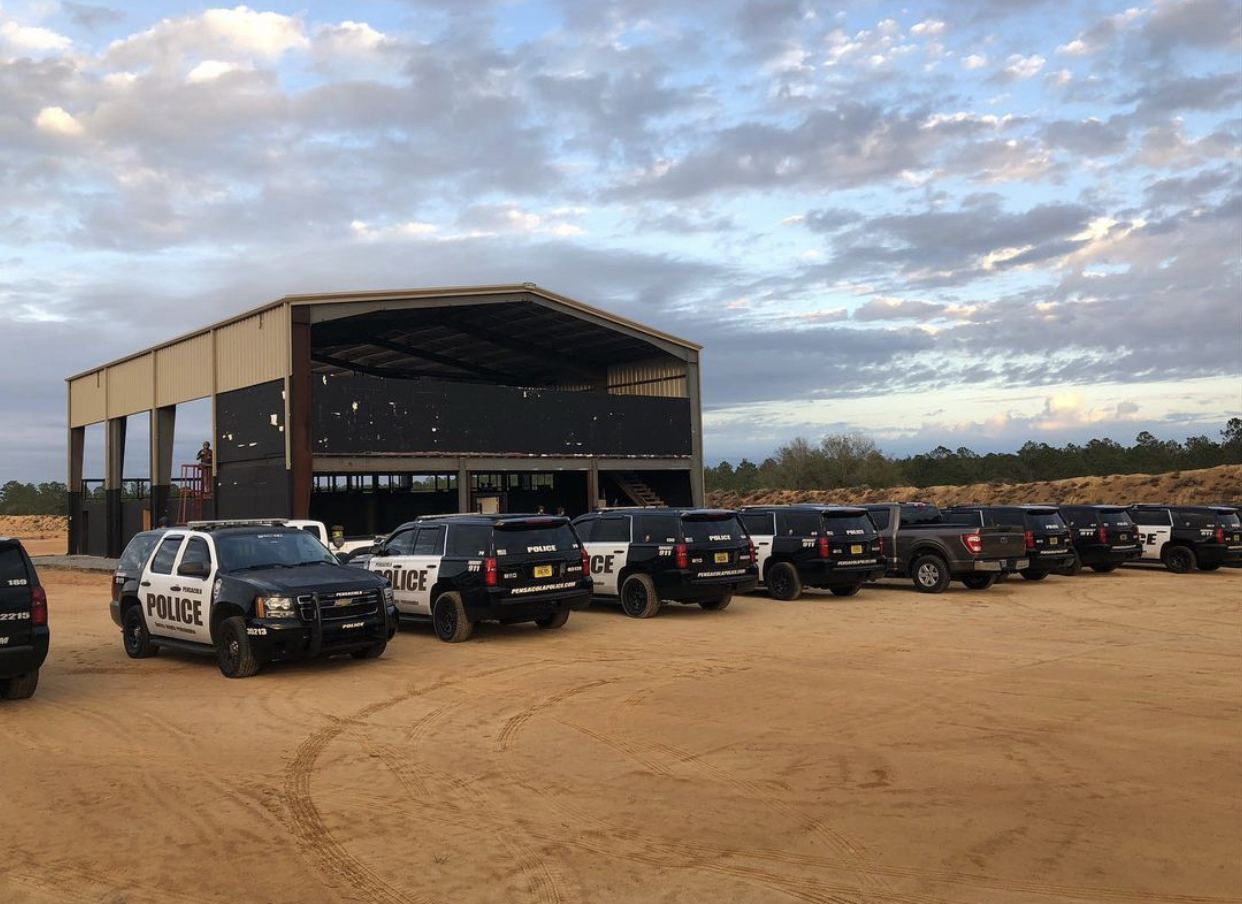 Police teams staged outside the shoot house